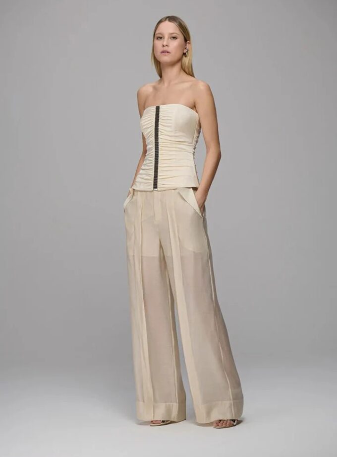 CALÇA COM TRANSPARENCIA E RECORTES ORGANICOS